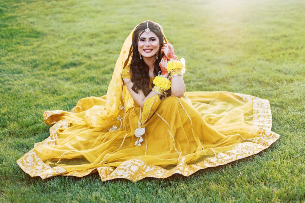 Mehndi Ceremony Indian Wedding with Bride in traditional lehenga